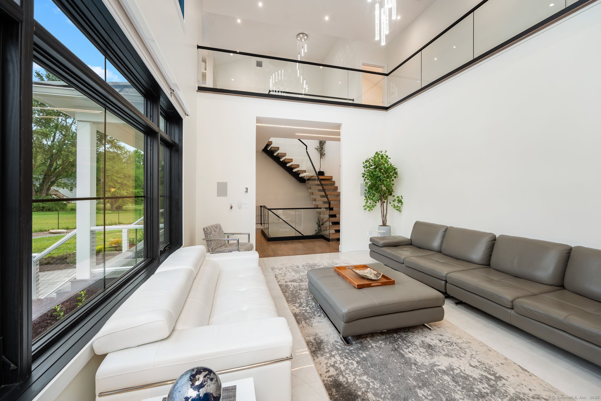 Undisclosed Address Norwich, CT 06360 - Photo 34 of 40 a living room with furniture and a floor to ceiling window