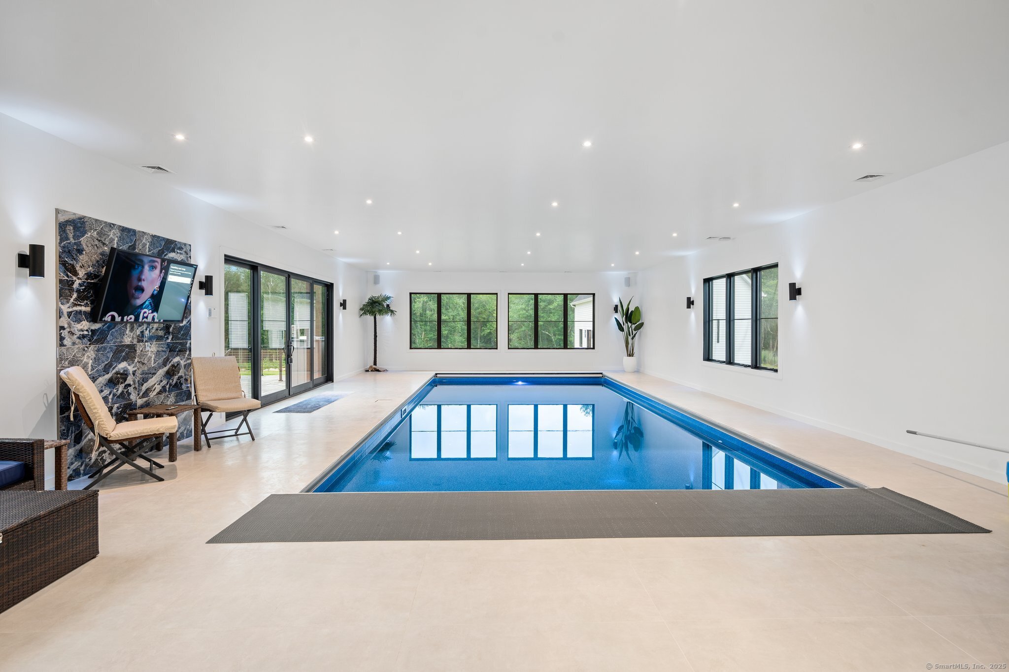 Undisclosed Address Norwich, CT 06360 - Photo 38 of 40 a living room with furniture pool table and a flat screen tv