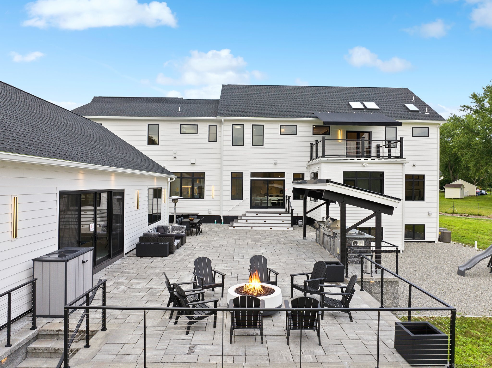 Undisclosed Address Norwich, CT 06360 - Photo 39 of 40 a view of a patio with dining table and chairs with wooden floor