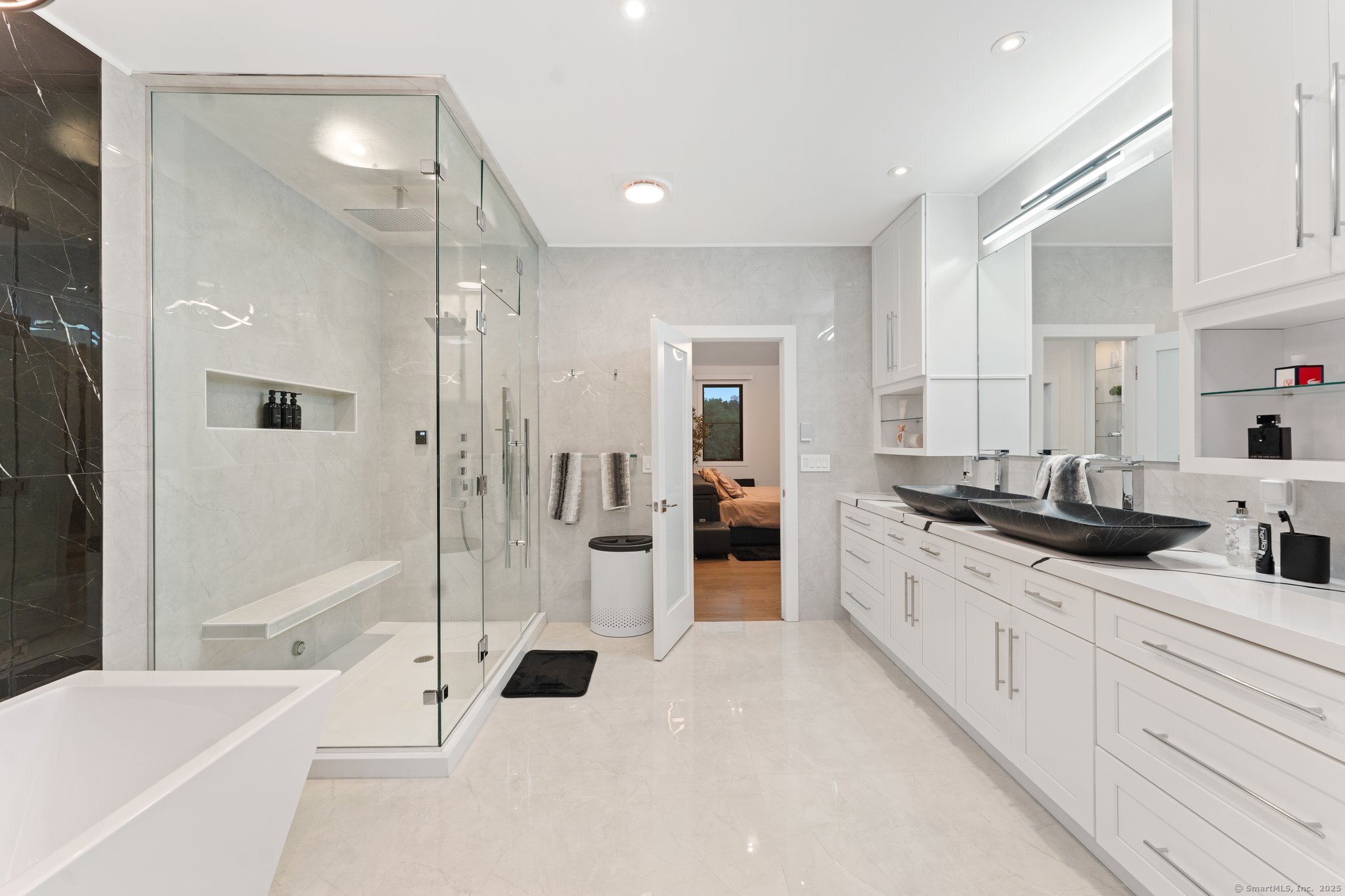 Undisclosed Address Norwich, CT 06360 - Photo 8 of 40 a large bathroom with a glass door shower a sink and a mirror