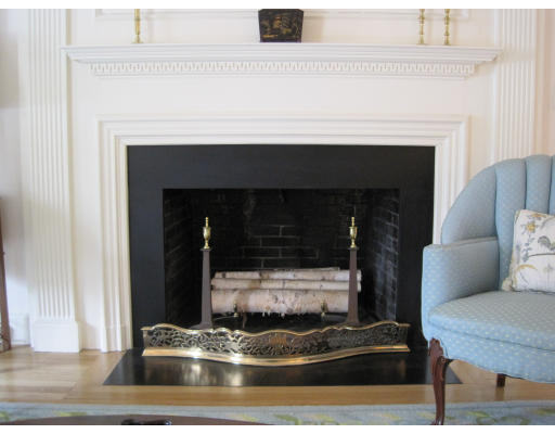 25 Audubon Road Wellesley, MA 02481 - Photo 4 of 15 a living room with furniture and a fireplace
