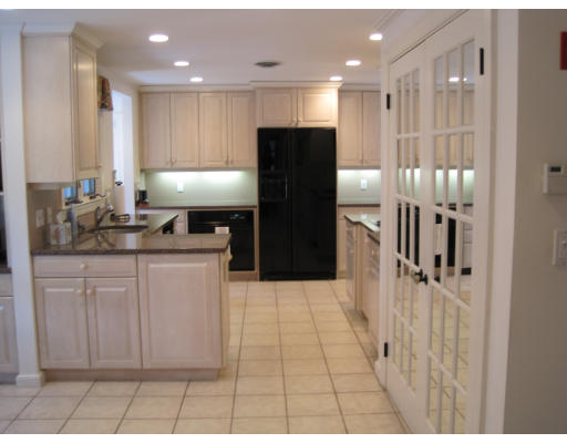25 Audubon Road Wellesley, MA 02481 - Photo 5 of 15 a kitchen with a refrigerator and a sink