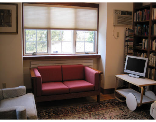 25 Audubon Road Wellesley, MA 02481 - Photo 8 of 15 a living room with furniture a bookshelf and a window