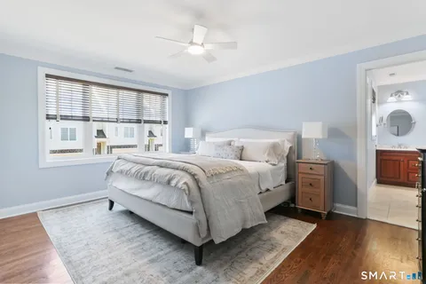 a bed room with a bed and a night stand