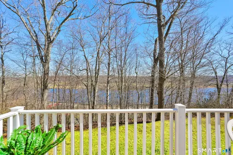 a view of small yard with wooden fence