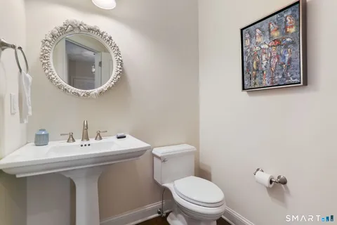 a bathroom with a toilet and a sink