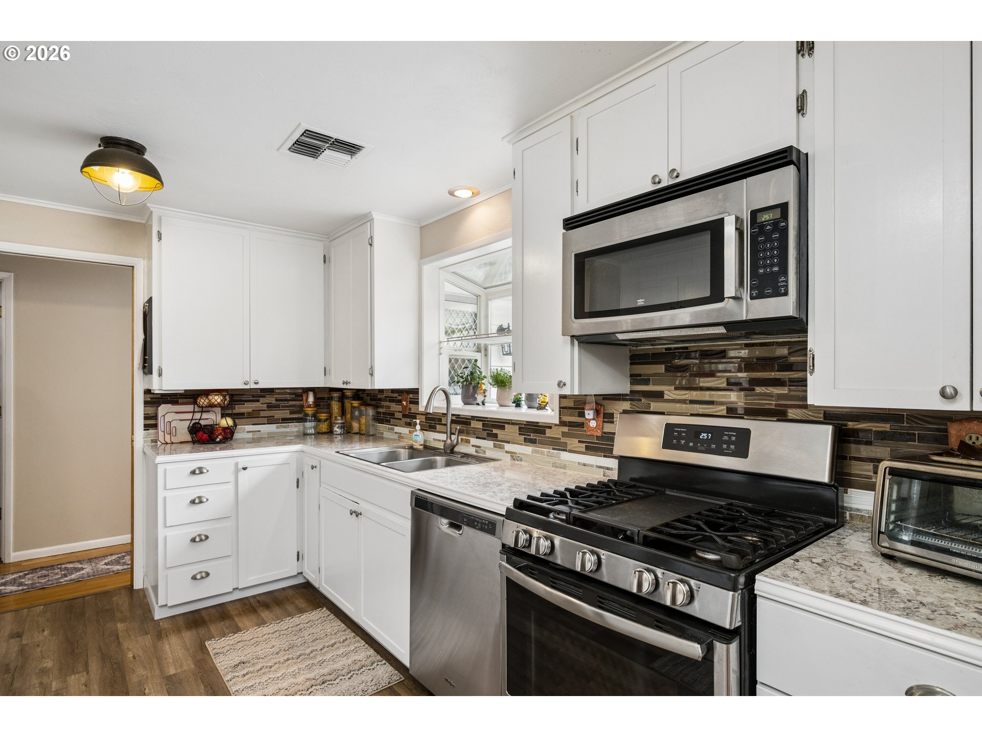420 Riverview Boulevard Springfield, OR 97477 - Photo 9 of 28 a kitchen with stainless steel appliances a stove cabinets and microwave