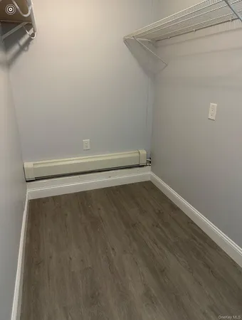 a view of room with racks on the wall