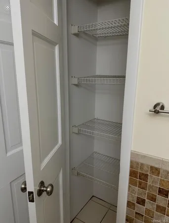 a bathroom with a glass door shower