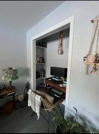 a workspace with furniture and rug