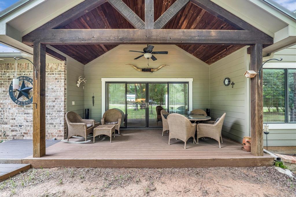 613 Bone Road Valley Mills, TX 76689 - Photo 27 of 40 a dining room with wooden floor and a rug