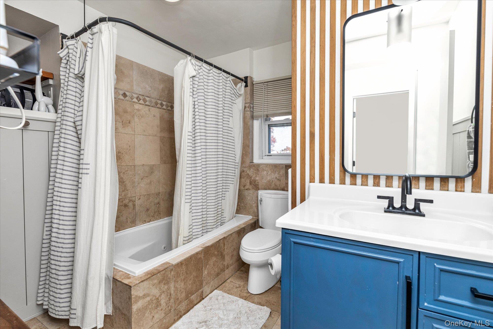 13 Gotham Street Valley Stream, NY 11581 - Photo 13 of 22 a bathroom with a sink and a mirror