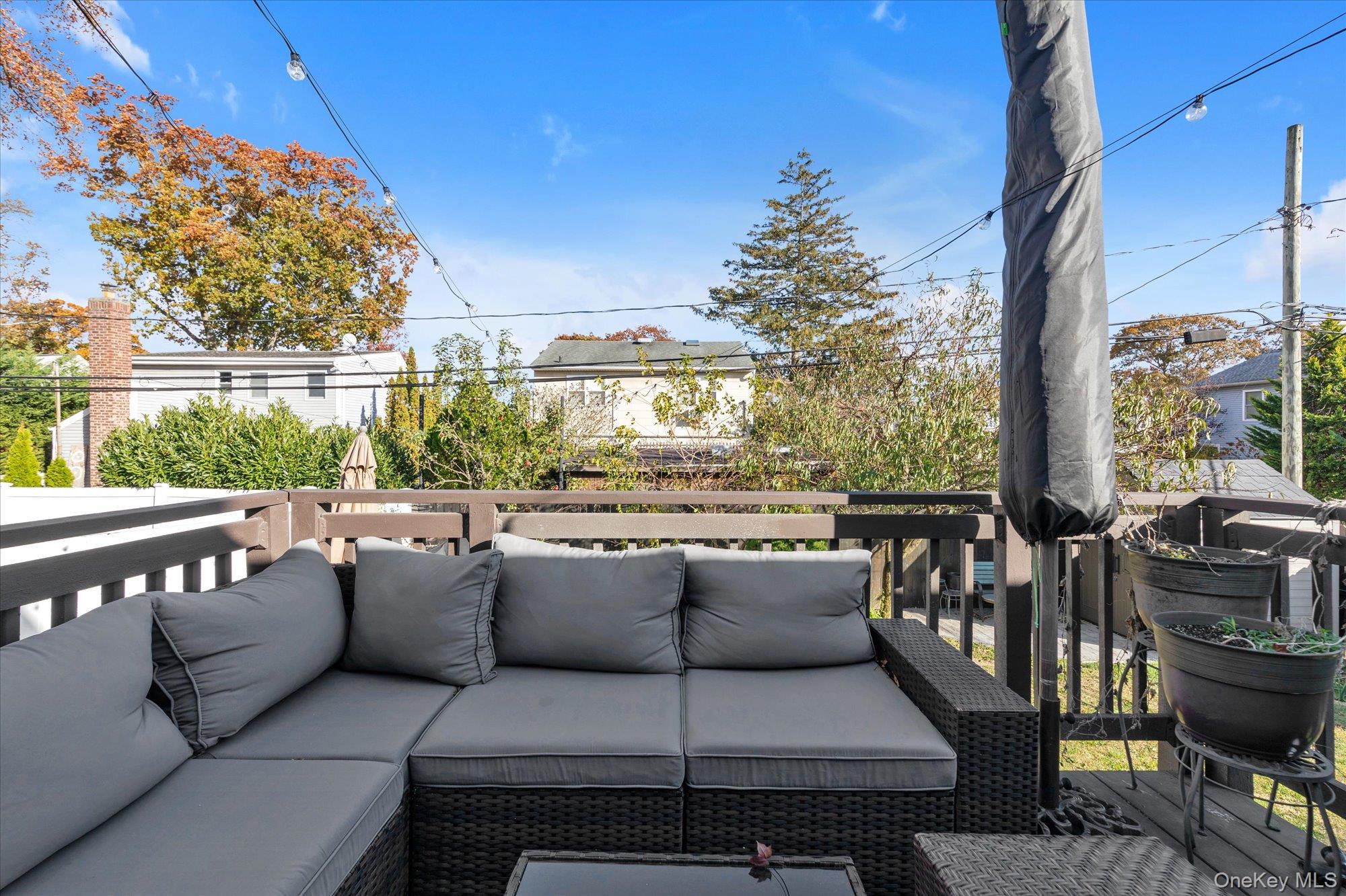 13 Gotham Street Valley Stream, NY 11581 - Photo 17 of 22 a roof deck with couches and potted plants