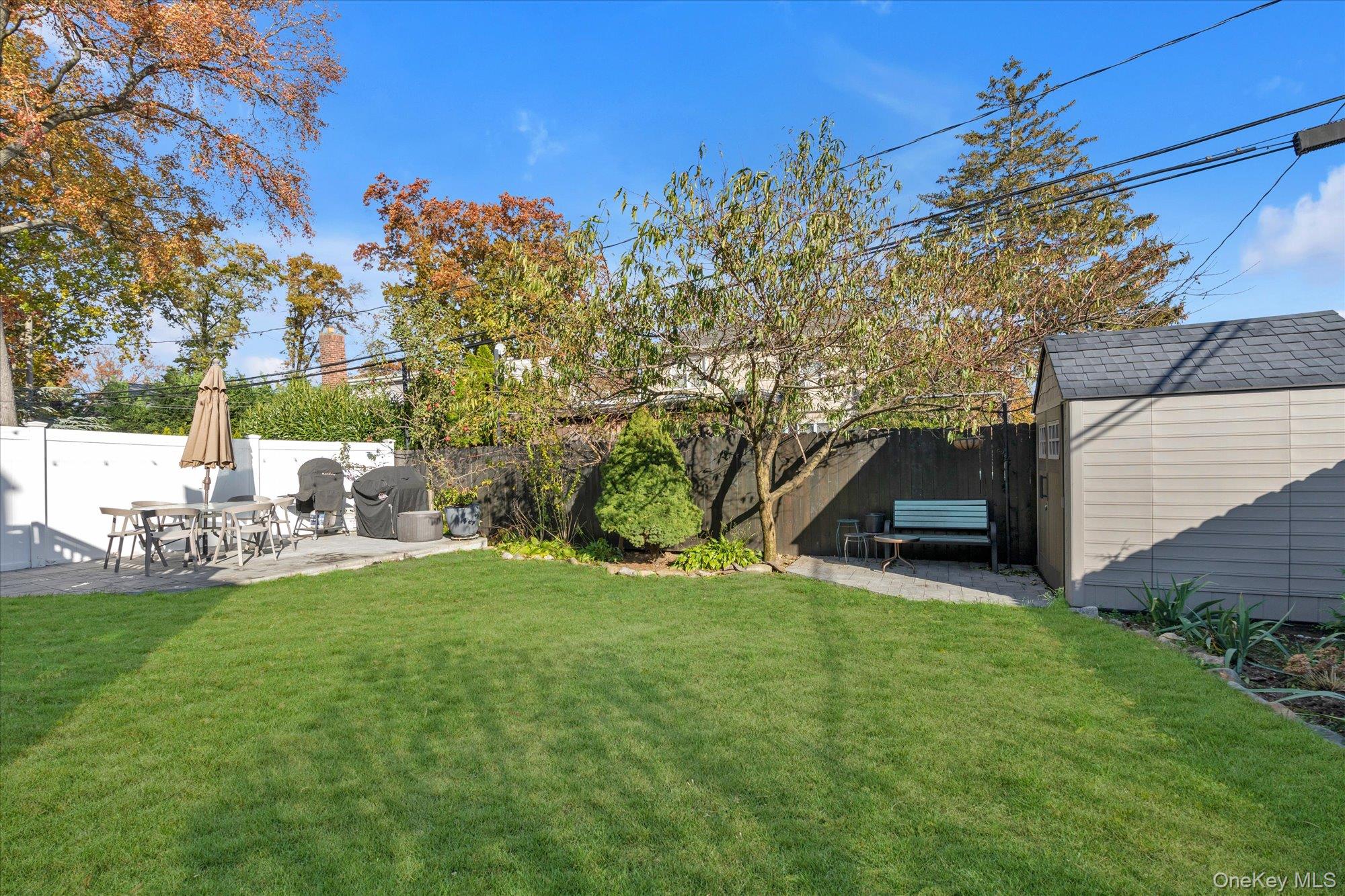 13 Gotham Street Valley Stream, NY 11581 - Photo 20 of 22 a view of backyard with swimming pool