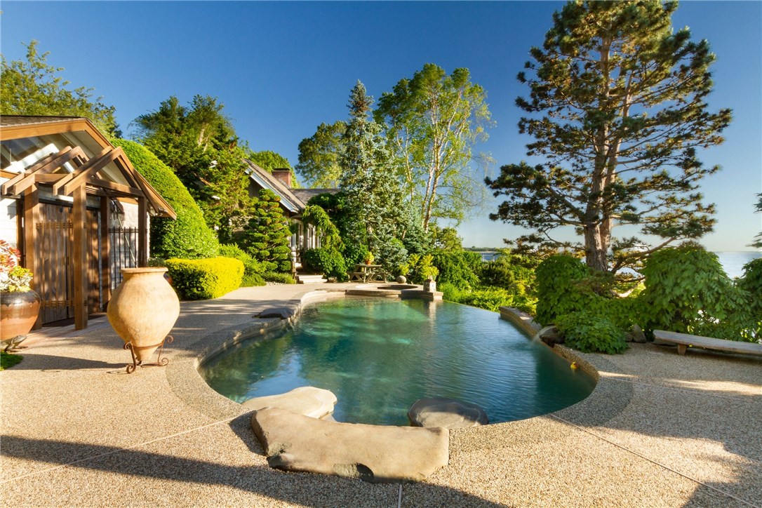 79 Shore Road Bristol, RI 02809 - Photo 23 of 47 View of the heated infinity pool and cabana with the Main House in the distance