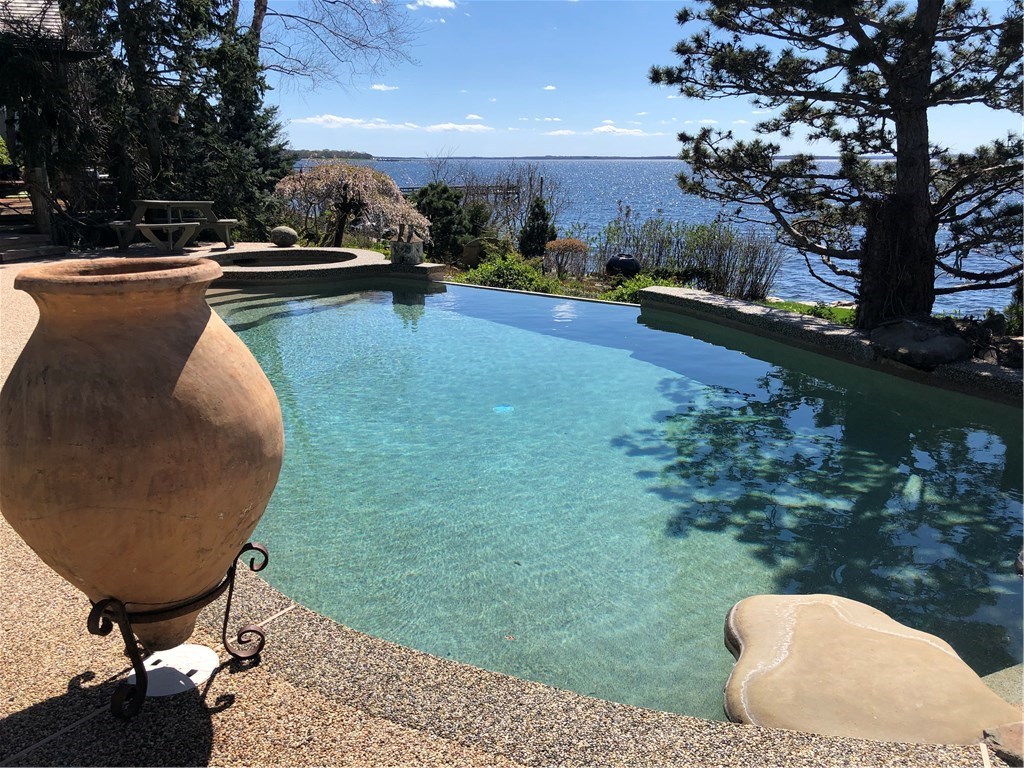79 Shore Road Bristol, RI 02809 - Photo 24 of 47 Heated infinity pool joins main house to guest house