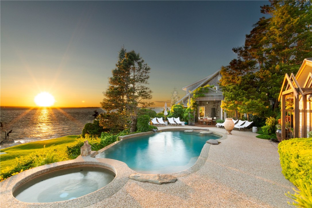 79 Shore Road Bristol, RI 02809 - Photo 25 of 47 Poolside at sunset. The guest house flows beautifully from the pool for easy entertaining