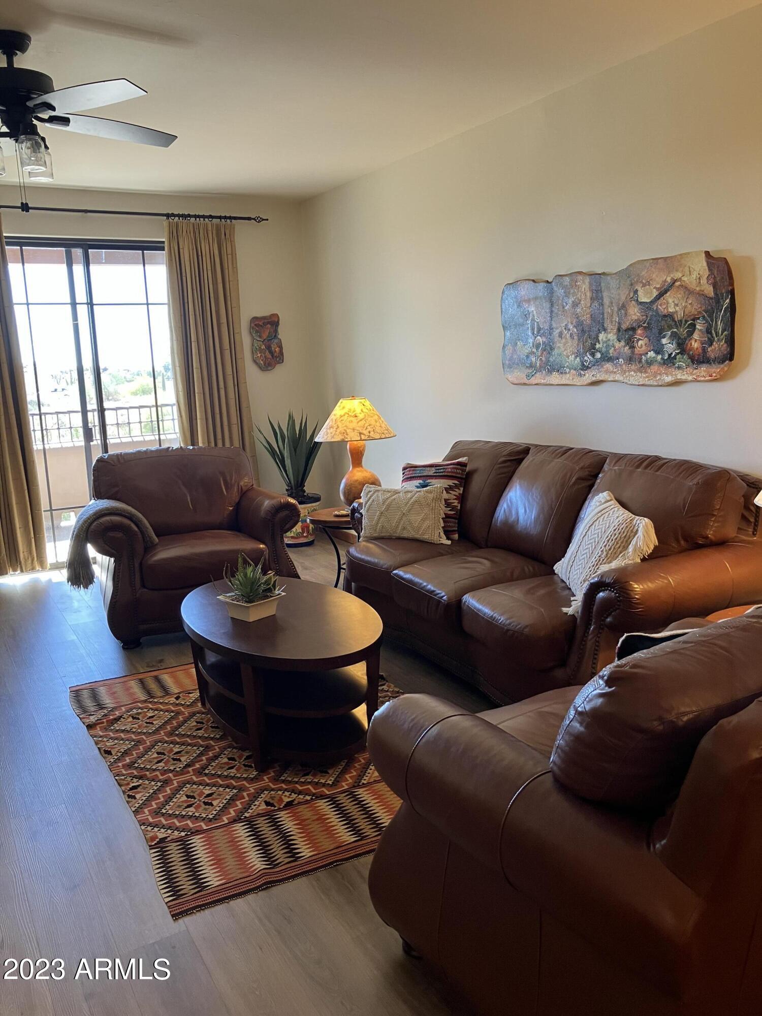 36601 North Mule Train Road, Unit 29C Carefree, AZ 85377 - Photo 11 of 35 a living room with furniture and a large window