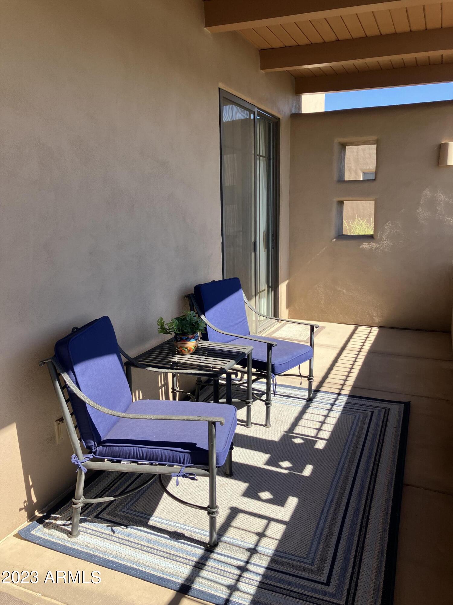 36601 North Mule Train Road, Unit 29C Carefree, AZ 85377 - Photo 17 of 35 a patio with tables and chairs