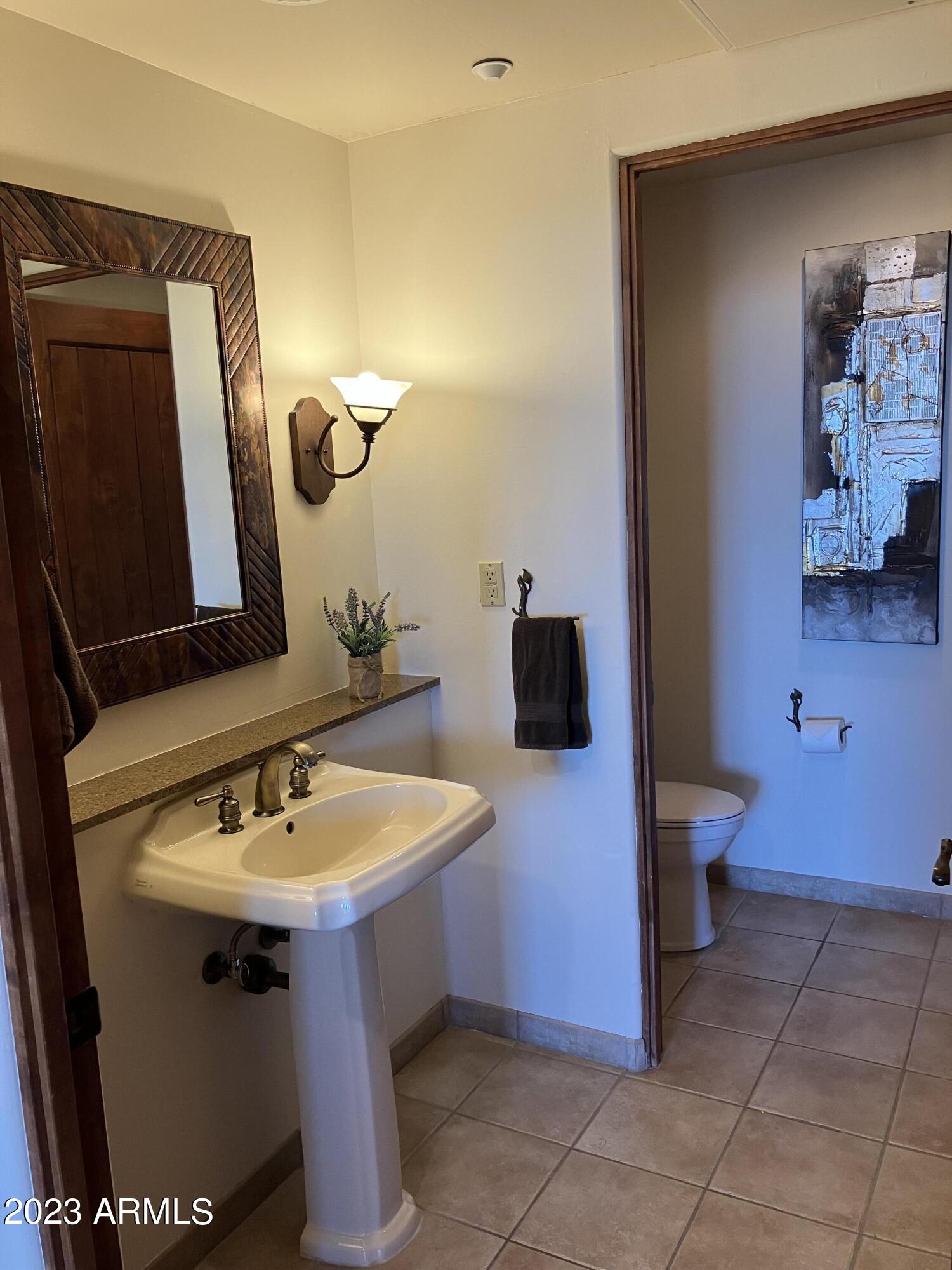 36601 North Mule Train Road, Unit 29C Carefree, AZ 85377 - Photo 27 of 35 a bathroom with a sink and a mirror