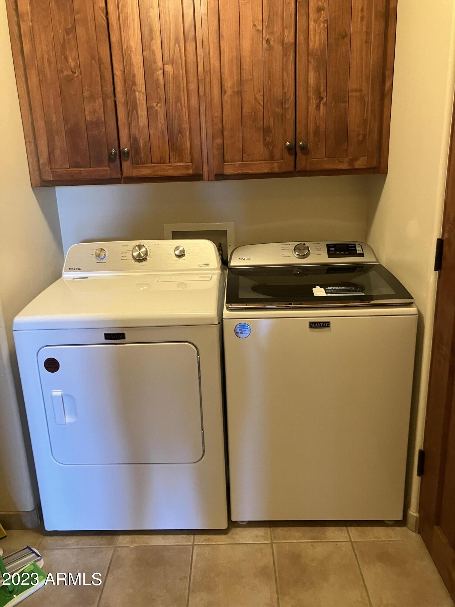 36601 North Mule Train Road, Unit 29C Carefree, AZ 85377 - Photo 32 of 35 a utility room with dryer and washer