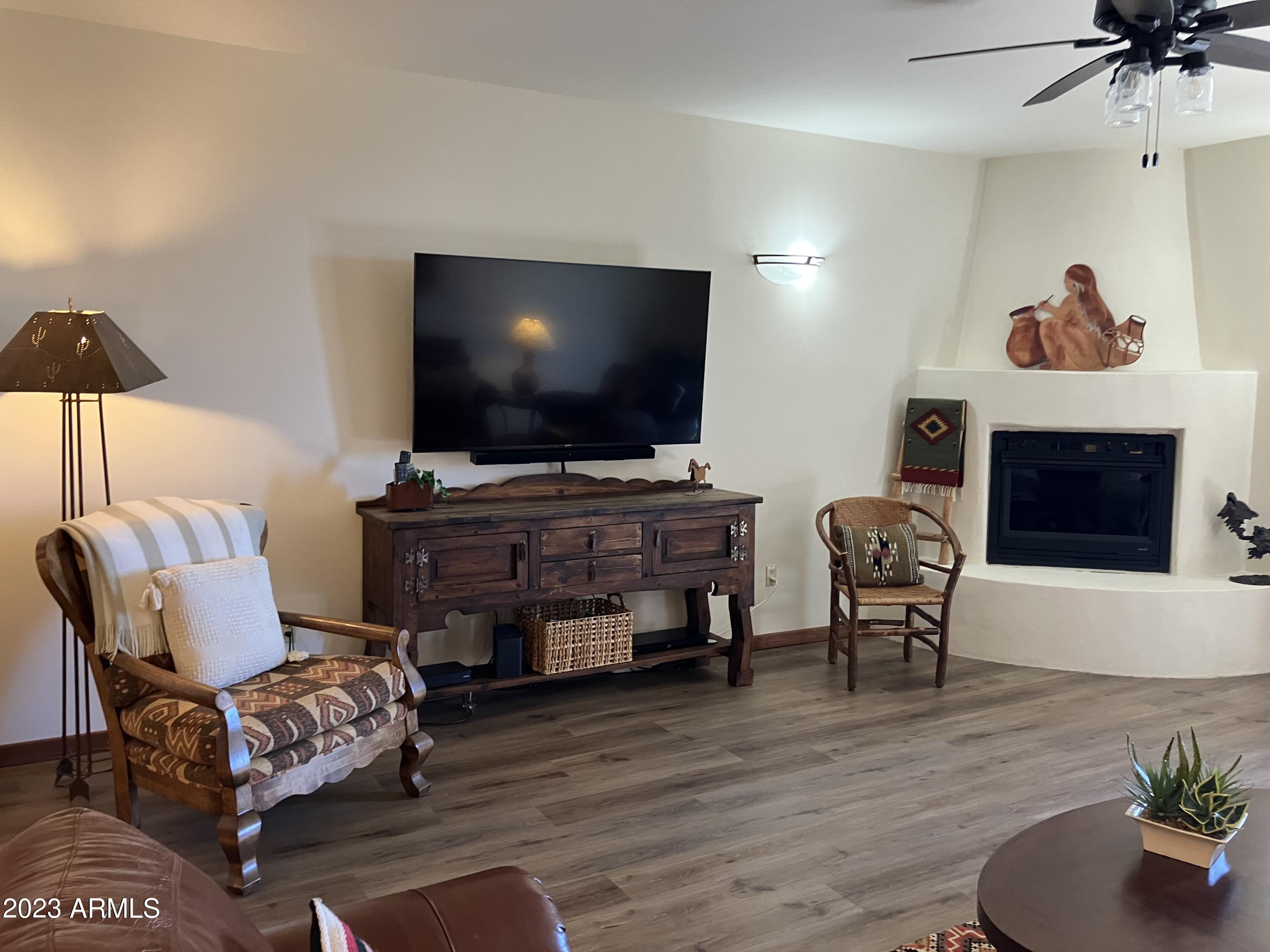 36601 North Mule Train Road, Unit 29C Carefree, AZ 85377 - Photo 10 of 35 a living room with furniture and a flat screen tv