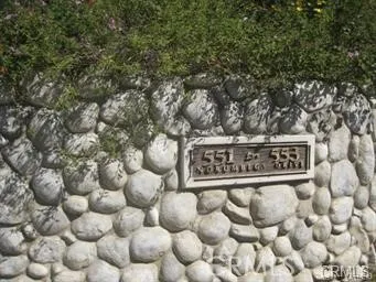 a sign broad in front of the tree