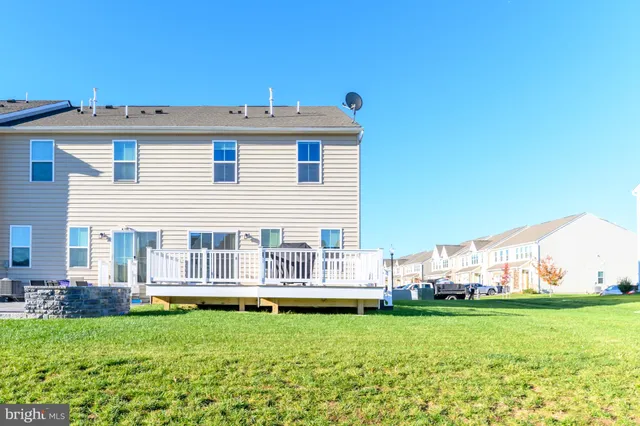 a view of backyard with large trees