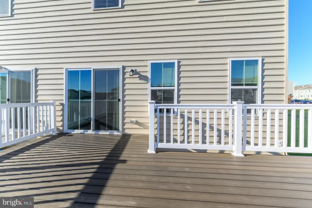 a front view of a building with a garden