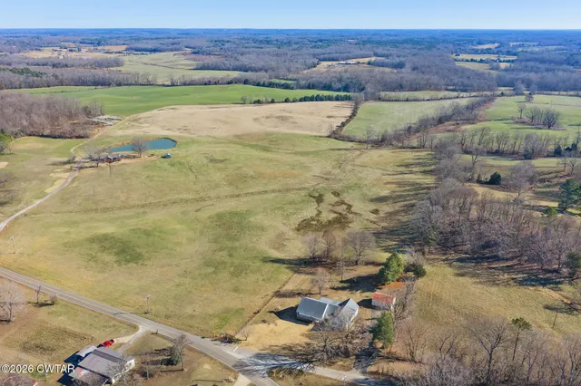 a backyard of a house with outdoor seating