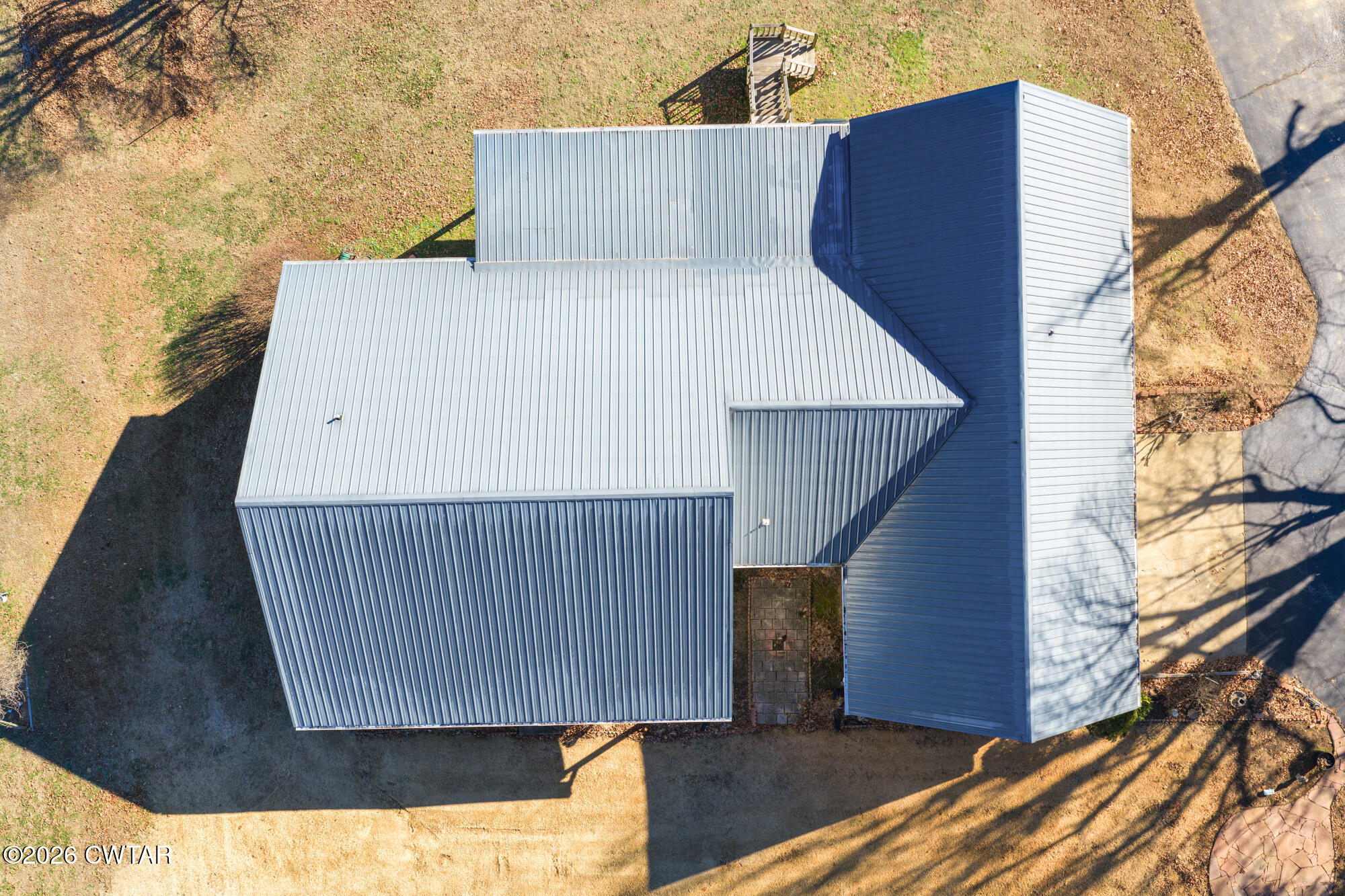 3149 Sand Ridge Road Lexington, TN 38351 - Photo 16 of 40 a view of backyard with small cabin and wooden fencing