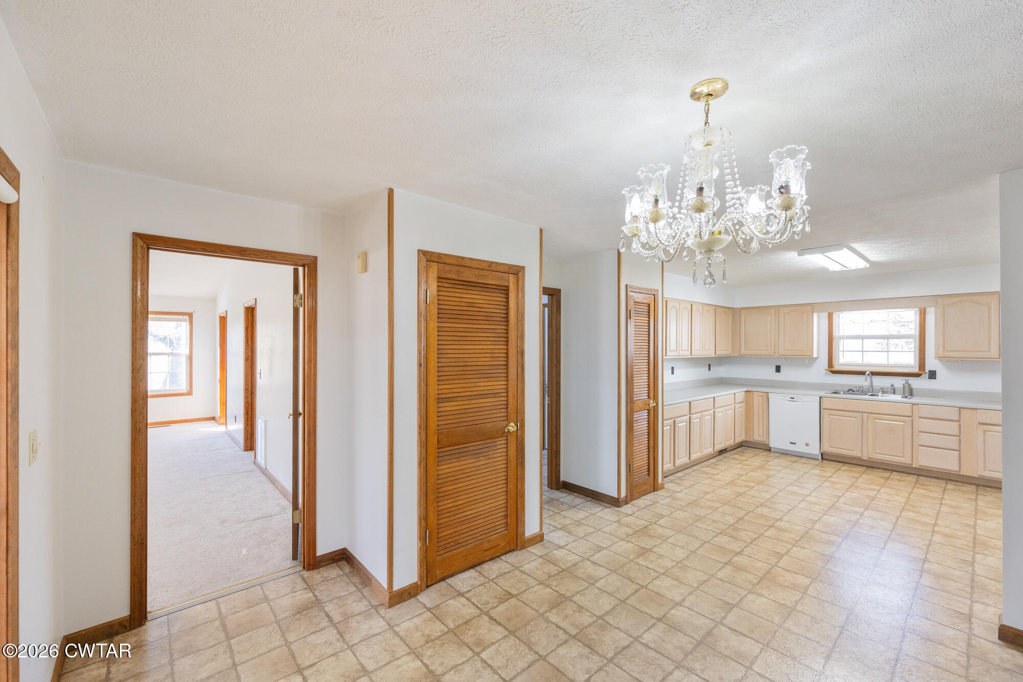 3149 Sand Ridge Road Lexington, TN 38351 - Photo 22 of 40 a view of a room with chandelier and living room