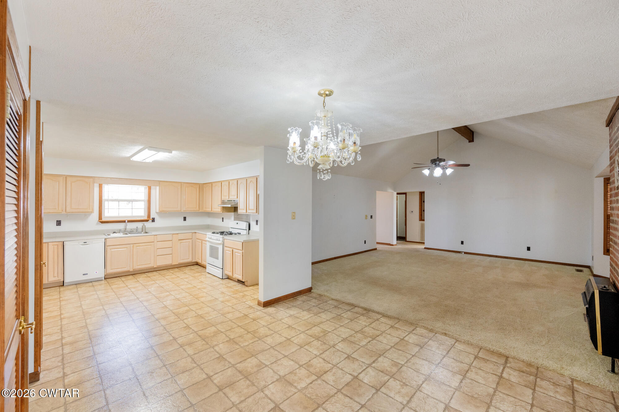 3149 Sand Ridge Road Lexington, TN 38351 - Photo 23 of 40 a view of a kitchen with a sink and a refrigerator