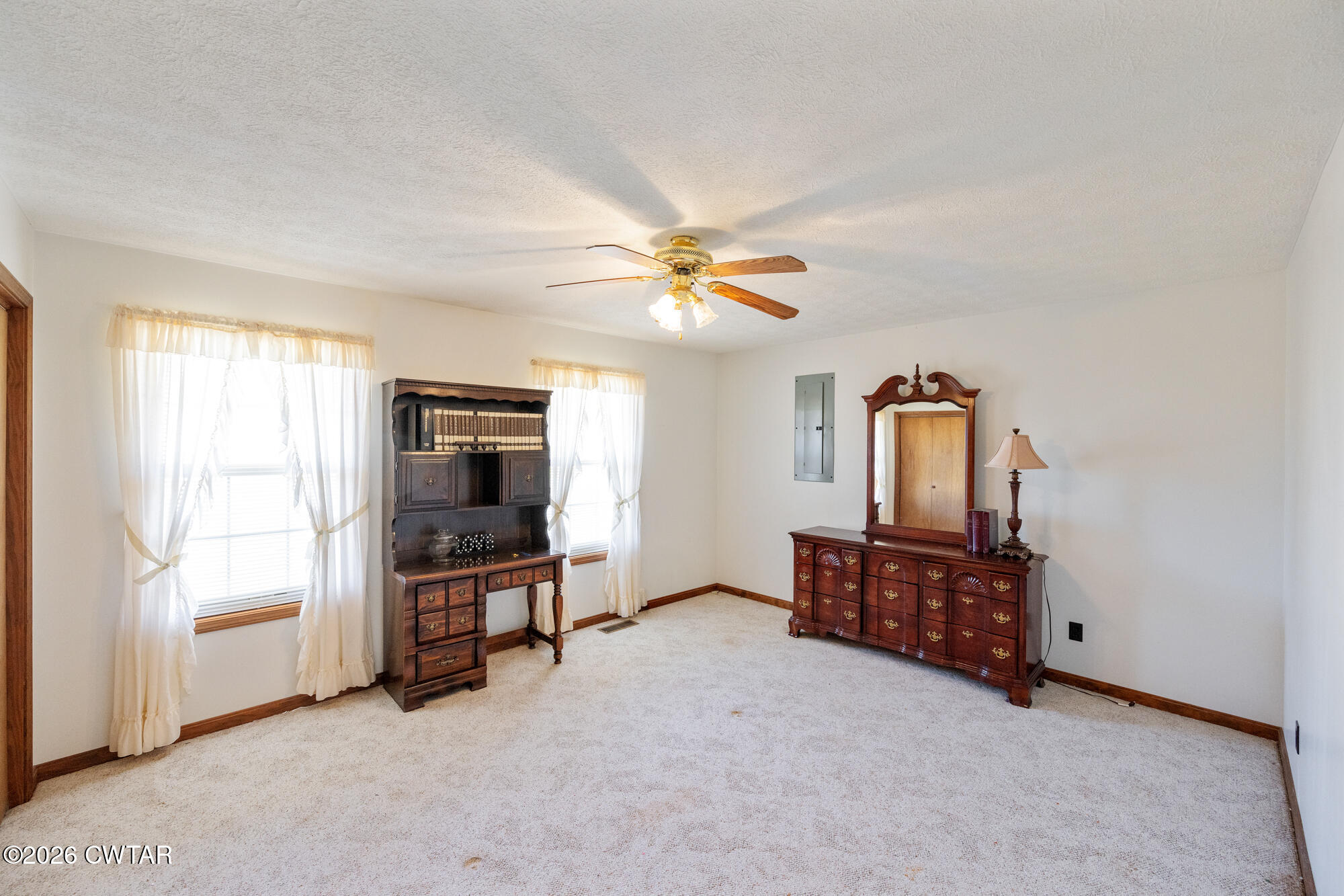 3149 Sand Ridge Road Lexington, TN 38351 - Photo 29 of 40 an empty room with windows and ceiling fan