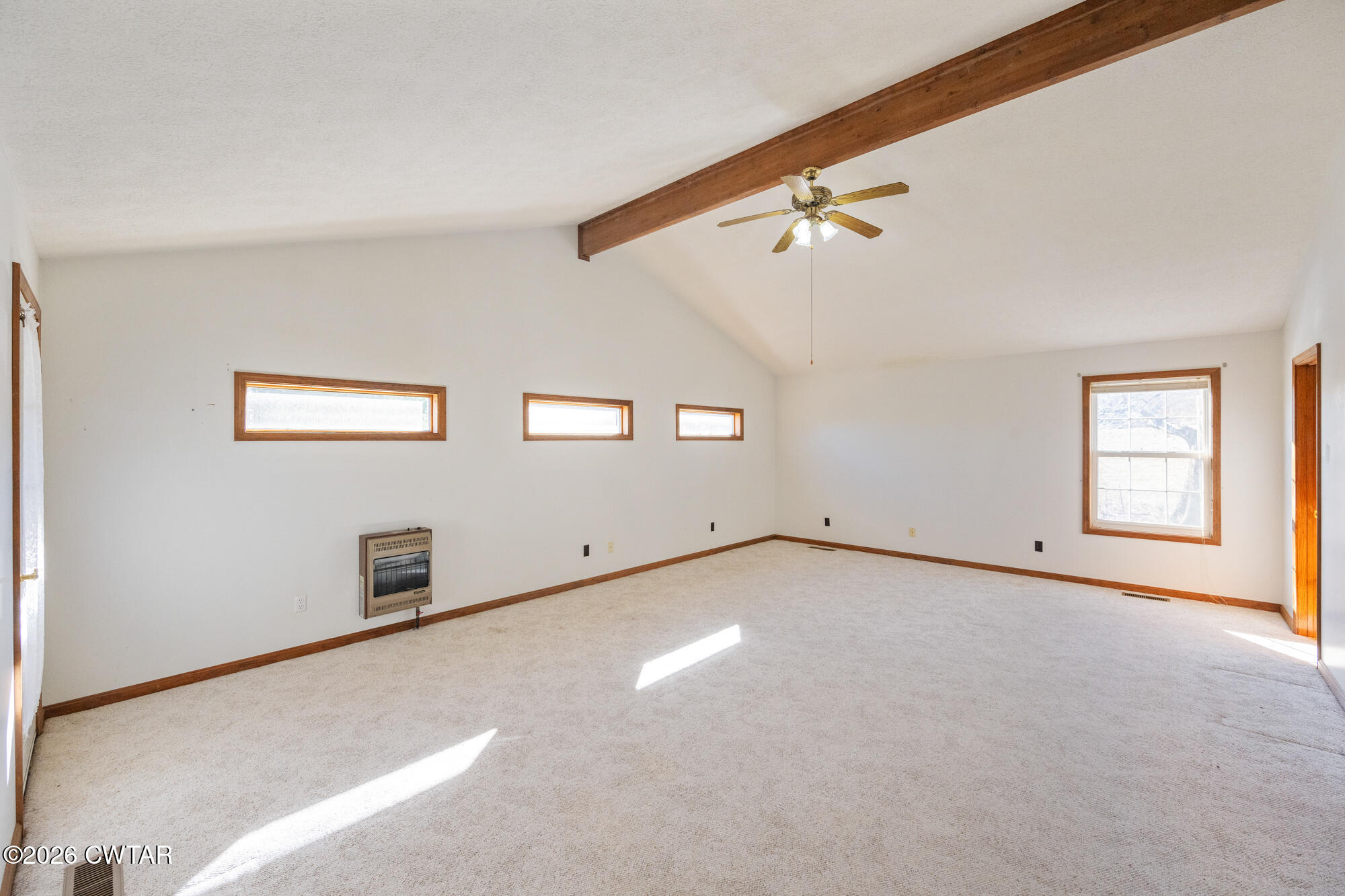 3149 Sand Ridge Road Lexington, TN 38351 - Photo 33 of 40 an empty room with windows and ceiling fan
