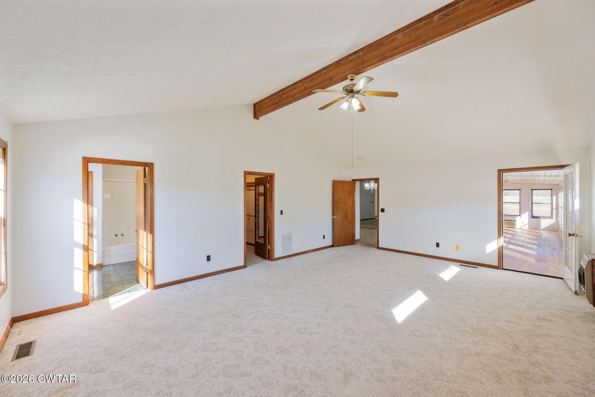 3149 Sand Ridge Road Lexington, TN 38351 - Photo 34 of 40 an empty room with windows and ceiling fan