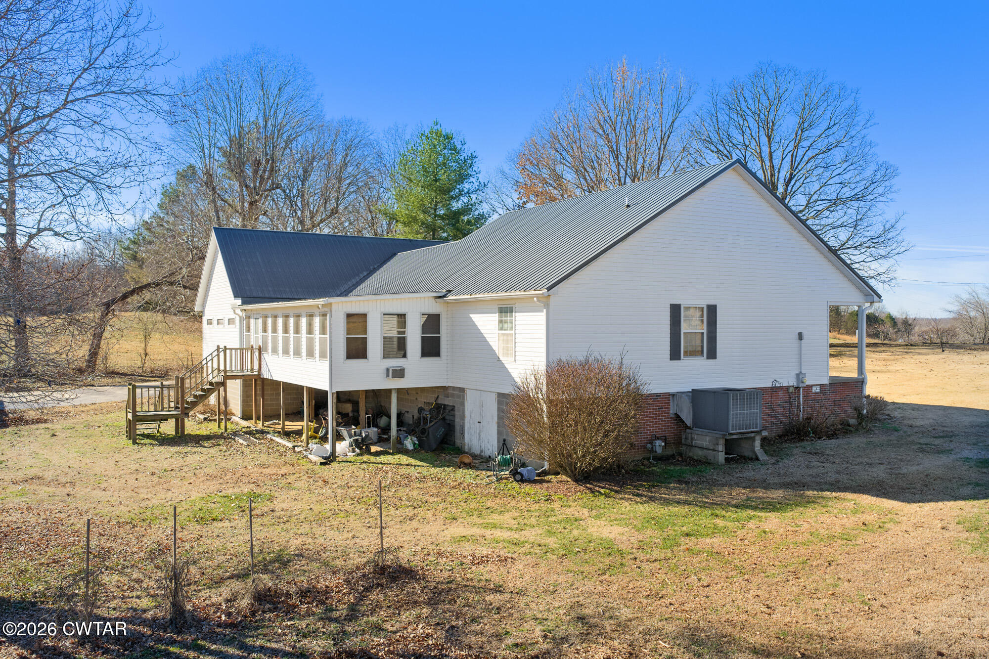 3149 Sand Ridge Road Lexington, TN 38351 - Photo 6 of 40 a view of a house with snow on the road