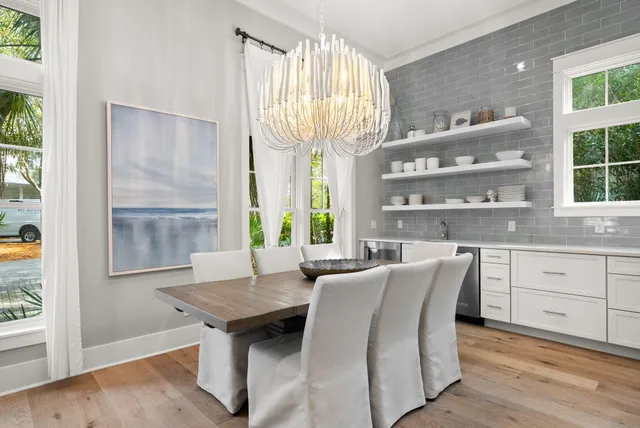 a large kitchen with a table and chairs