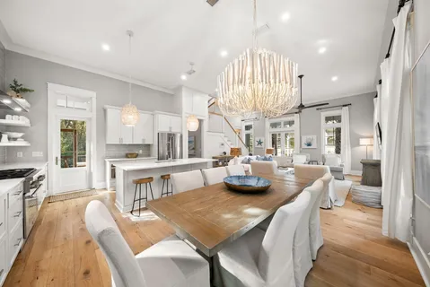 a kitchen with refrigerator cabinets and wooden floor