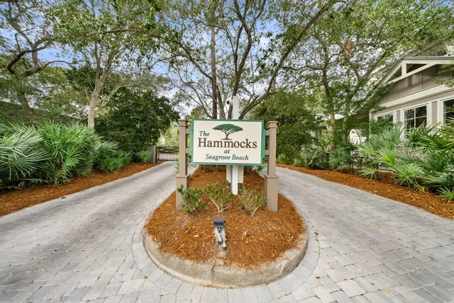 a sign that is on a brick wall