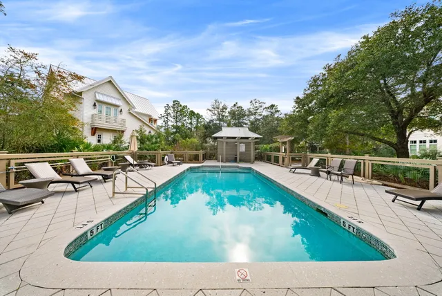 a view of a swimming pool with a lounge chair