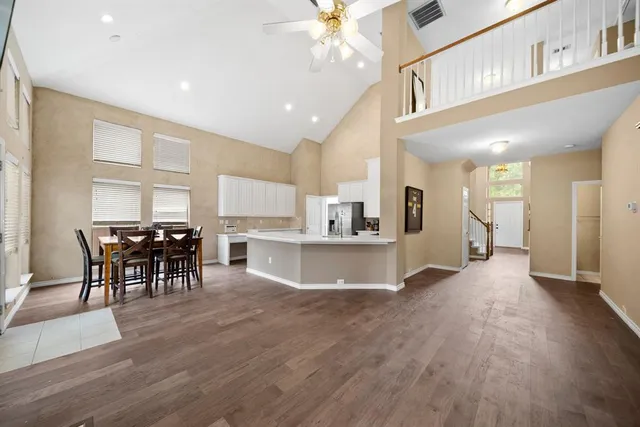 a view of a dining area with furniture and wooden floor