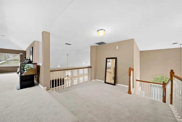a view of a hallway with living room
