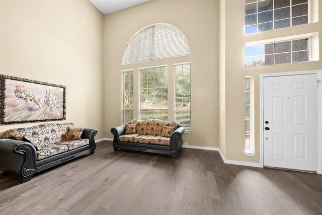 a living room with furniture and a large window