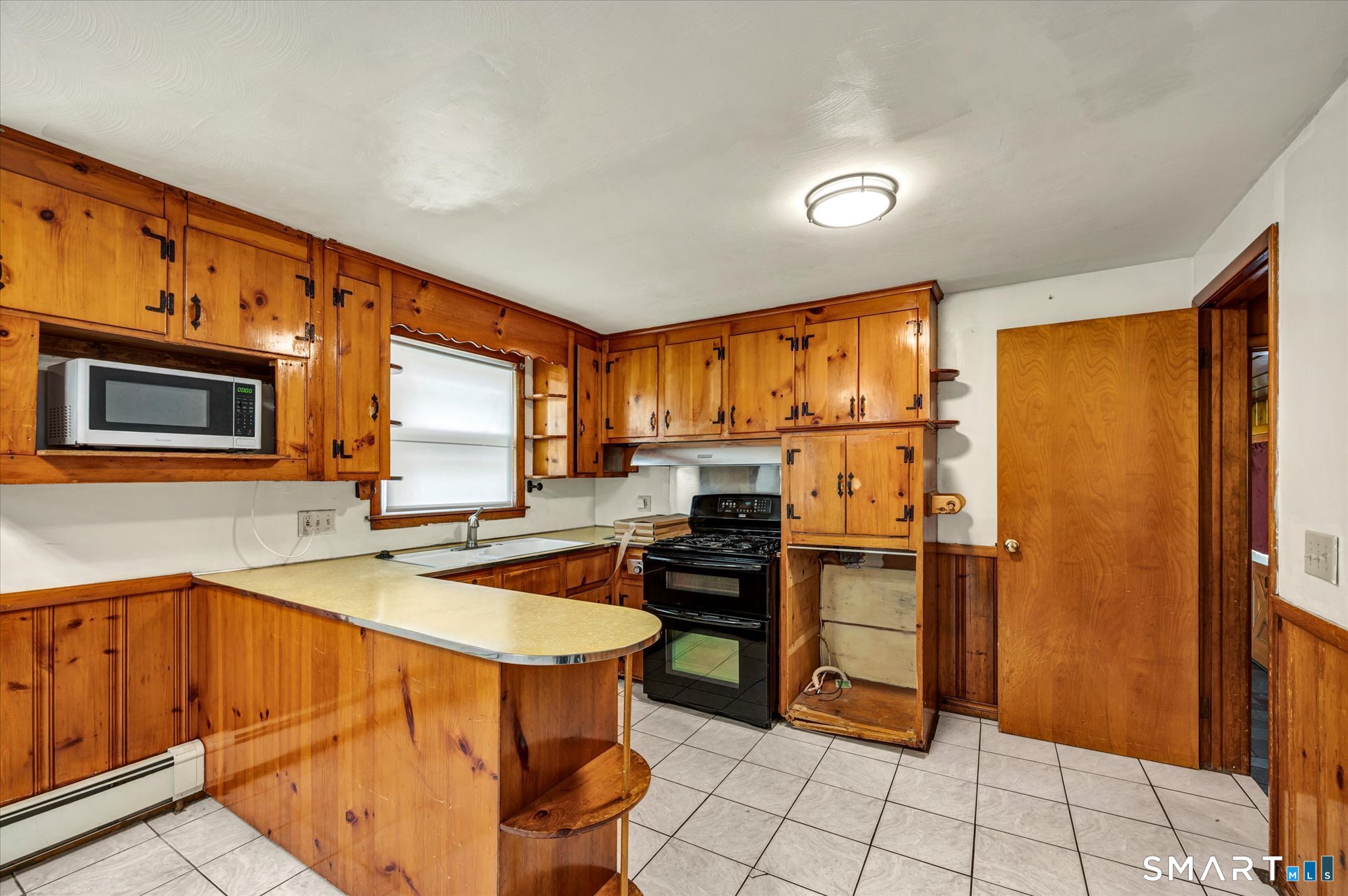 740 Rainbow Road Windsor, CT 06095 - Photo 14 of 40 a kitchen with stainless steel appliances granite countertop a refrigerator and a stove top oven