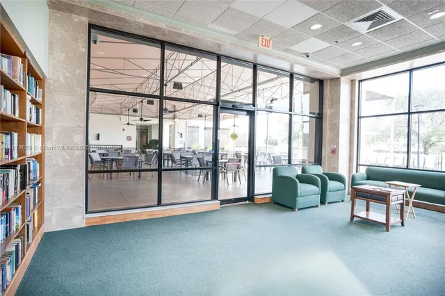 a dining hall with lots of tables and chairs