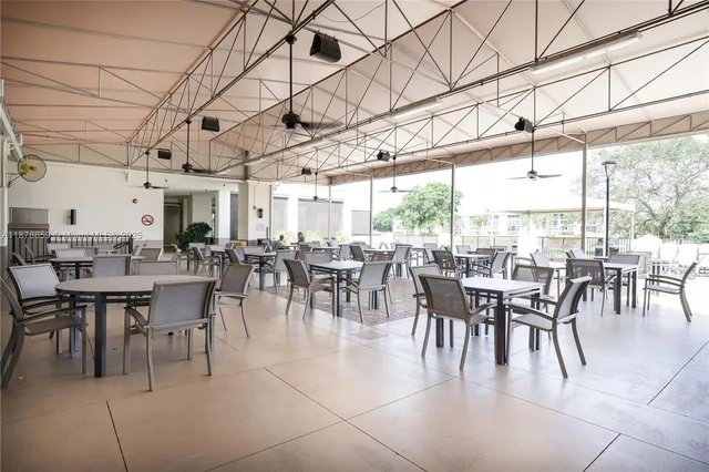 a view of a patio with a table and chairs