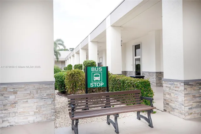 a room with pool table and chairs