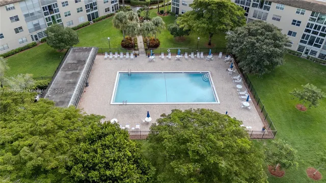 a aerial view of a house with a yard