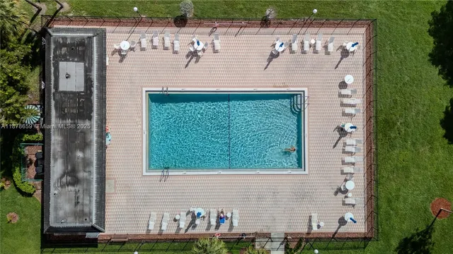 an aerial view of residential houses with outdoor space and river